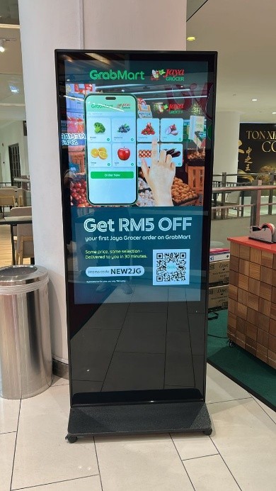 Digital standee ad illustrating billboard advertising cost in Malaysia and modern digital billboards pricing.